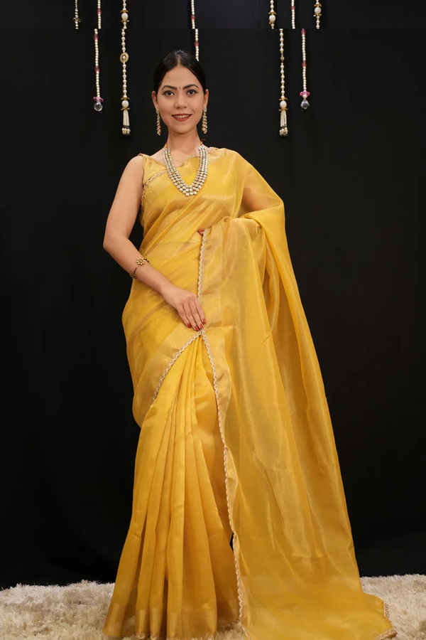 MUSTARD YELLOW SOFT JIMMY CHOO FABRIC WITH ZARI WEAVE BORDER AND GOLDEN ZARI PIPING LACE PRE DRAPE SAREE